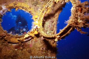 My buddy behind  a porthole  of  " Capua" wreck.
In 1980... by Alberto Romeo 